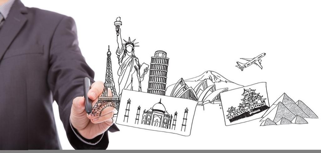Business man drawing the dream travel around the world